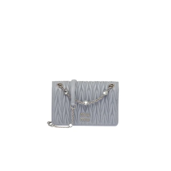 Matelassé Mini Bag: Elevate your style with this sophisticated and three-dimensional leather mini-bag. The exquisite craftsmanship of matelassé gives this nappa leather mini-bag a beautifully intricate and 3D appearance. The lettering logo on the flap perfectly complements the metallic hardware, accentuating the impeccable artisanal workmanship and creating an instantly recognizable symbol. With its elegant and compact silhouette, chain shoulder strap with shoulder pad, and convenient magnet closure, this bag is both practical and visually appealing in every detail.