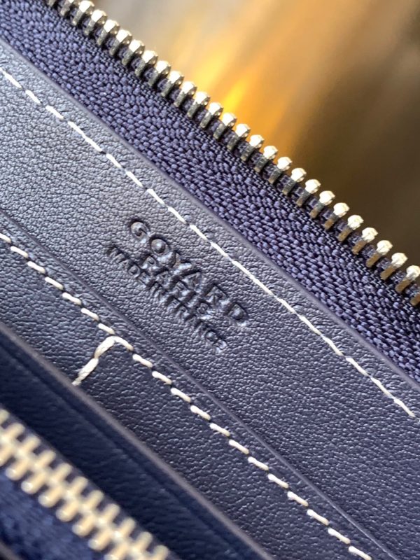 Matignon GM Wallet: A Statement of Elegance and Functionality. Experience luxury and functionality with the Goyard Matignon GM Wallet. Crafted from premium calf leather and Goyardine canvas, it offers twelve card slots, a zipper pocket, and two spacious compartments, all secured by a snap button closure. Handcrafted by skilled artisans, Whether you're running errands or gracing a formal occasion, this wallet is the ultimate style companion. Choose from an array of colors to reflect your personality and elevate your ensemble. With this wallet, you'll not only radiate elegance but also experience unparalleled functionality.