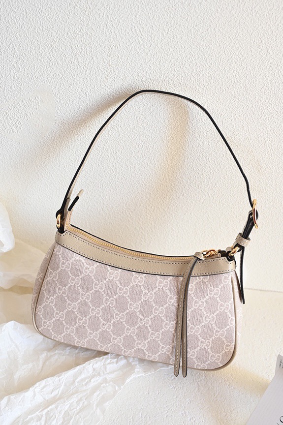 GUCCI Ophidia Small Handbag. Original Quality Bag including gift box, care book, dust bag, authenticity card. House collections continue the idea that pieces should be timeless and not just in fashion for one season. Guccio Gucci's everlasting monogram continues to enrich new designs with a logo feel. This Ophidia small handbag is presented in the historical GG Supreme canvas, complete with the Double G hardware.