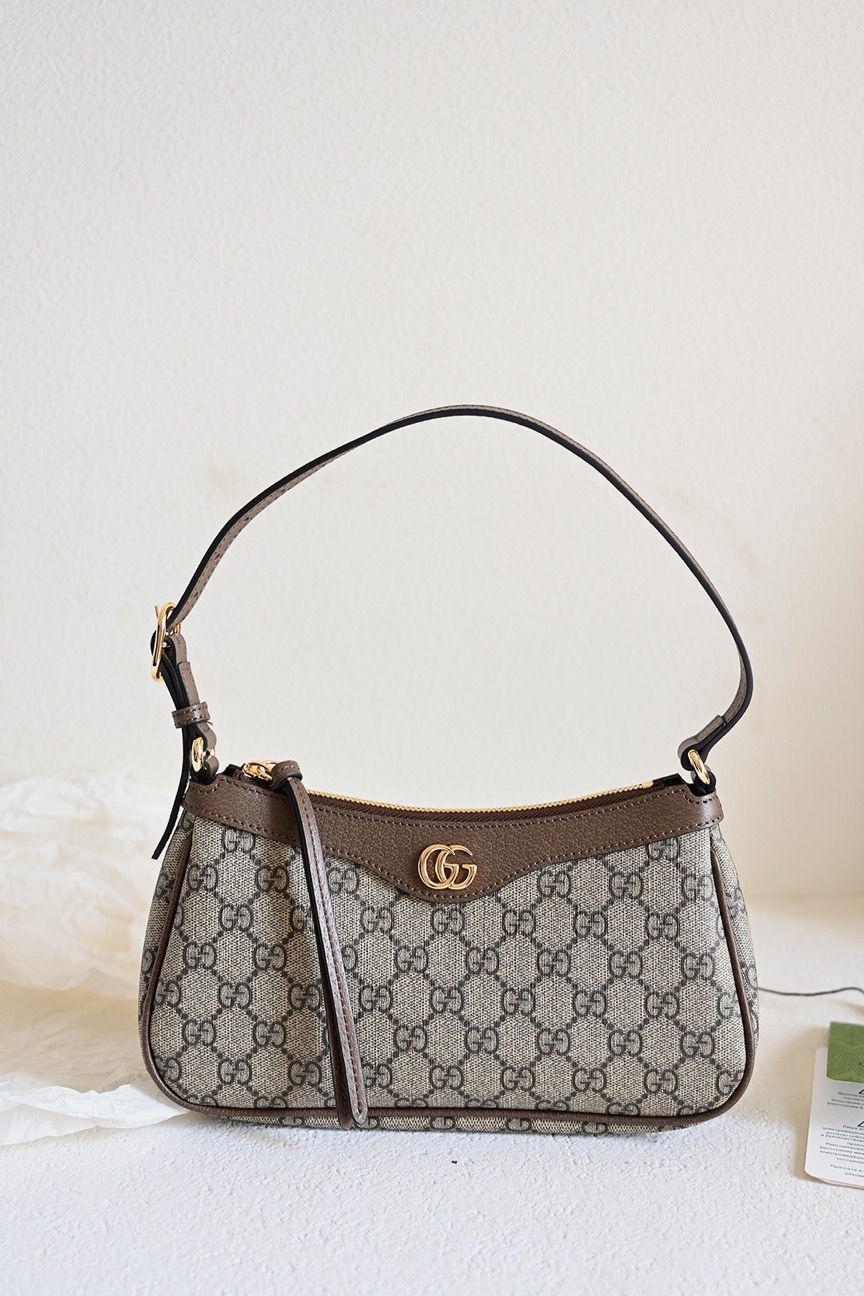 GUCCI Ophidia Small Handbag. Original Quality Bag including gift box, care book, dust bag, authenticity card. House collections continue the idea that pieces should be timeless and not just in fashion for one season. Guccio Gucci's everlasting monogram continues to enrich new designs with a logo feel. This Ophidia small handbag is presented in the historical GG Supreme canvas, complete with the Double G hardware.