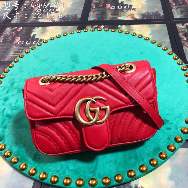 GUCCI GG Marmont Matelassé Mini Bag. High-end quality bag including gift box, literature, dust bag, authenticity card. The small GG Marmont chain shoulder bag has a softly structured shape and an oversized flap closure with Double G hardware. The sliding chain strap can be worn in multiple ways, changing between a shoulder and a top handle bag. Made in matelassé chevron leather with a heart on the back.