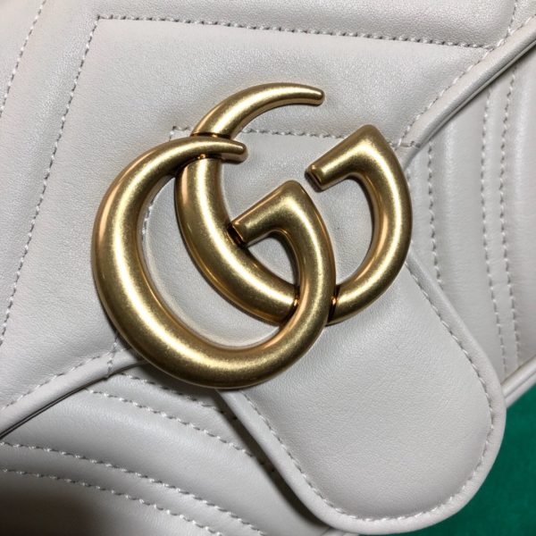 GUCCI GG Marmont Matelassé Mini Bag. High-end quality bag including gift box, literature, dust bag, authenticity card. The small GG Marmont chain shoulder bag has a softly structured shape and an oversized flap closure with Double G hardware. The sliding chain strap can be worn in multiple ways, changing between a shoulder and a top handle bag. Made in matelassé chevron leather with a heart on the back.