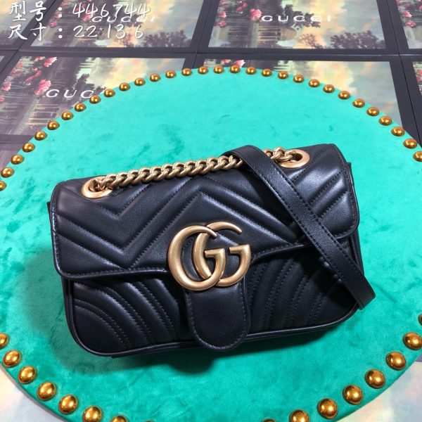 GUCCI GG Marmont Matelassé Mini Bag. High-end quality bag including gift box, literature, dust bag, authenticity card. The small GG Marmont chain shoulder bag has a softly structured shape and an oversized flap closure with Double G hardware. The sliding chain strap can be worn in multiple ways, changing between a shoulder and a top handle bag. Made in matelassé chevron leather with a heart on the back.