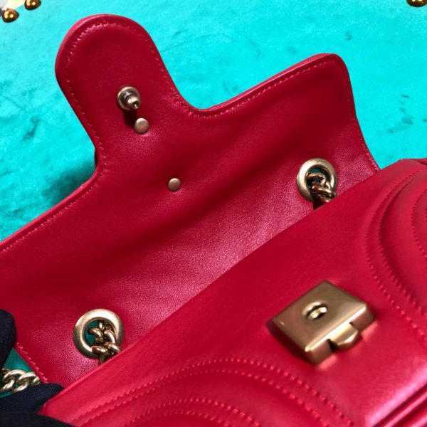 GUCCI GG Marmont Matelassé Mini Bag. High-end quality bag including gift box, literature, dust bag, authenticity card. The small GG Marmont chain shoulder bag has a softly structured shape and an oversized flap closure with Double G hardware. The sliding chain strap can be worn in multiple ways, changing between a shoulder and a top handle bag. Made in matelassé chevron leather with a heart on the back.
