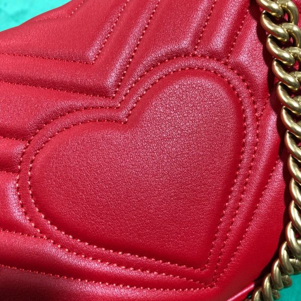 GUCCI GG Marmont Matelassé Mini Bag. High-end quality bag including gift box, literature, dust bag, authenticity card. The small GG Marmont chain shoulder bag has a softly structured shape and an oversized flap closure with Double G hardware. The sliding chain strap can be worn in multiple ways, changing between a shoulder and a top handle bag. Made in matelassé chevron leather with a heart on the back.