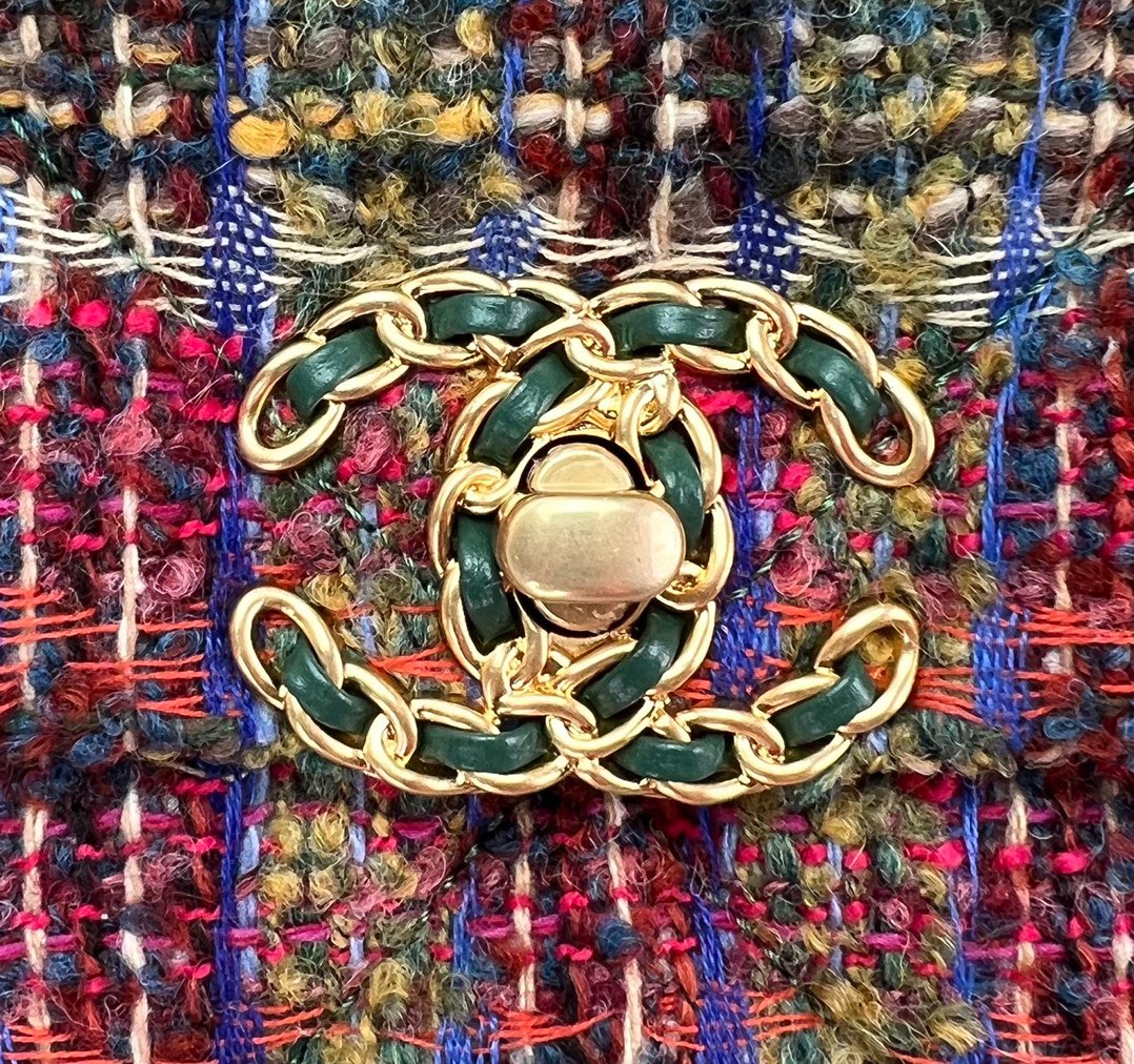 CHANEL 19 Tweed Flap Bag. Original Quality Bag including gift box, care book, dust bag, authenticity card. This Chanel 19 Flap Bag ticks all boxes and is quite possibly the most sought after bag in the world at this moment. Constructed from beautifully constructed Tweed Fibres and paired with the iconic Chanel 19 two-tone hardware, both Gold and Ruthenium. The refined bag features an aged gold chain detail CC turn-lock on the flap, a magnetic snap pocket at the rear and a leather threaded gradient gold to ruthenium chain-link strap with a leather shoulder pad. The front flap opens to a black fabric interior with a zipper pocket. This versatile bag with soft leather is an essential bag for any Chanel aficionado.