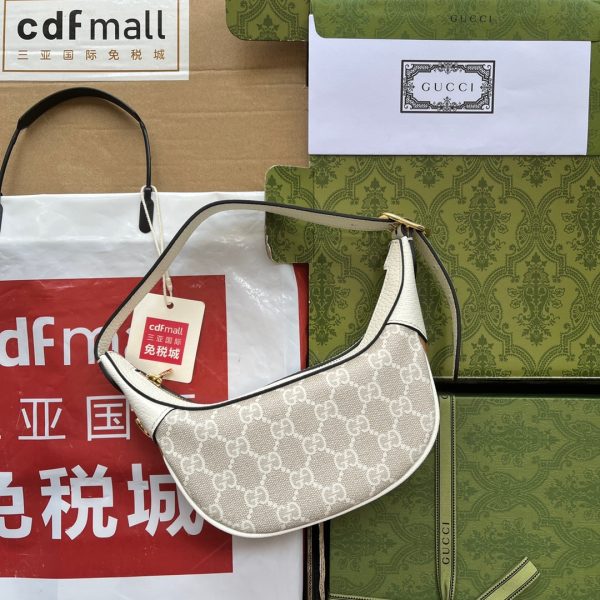 GUCCI Ophidia GG Mini Bag. Original Quality Bag including gift box, care book, dust bag, authenticity card. The world of Ophidia is enriched with the introduction of a crescent shaped mini bag. Crafted from the House's monogram canvas, the half-moon silhouette is infused with a retro spirit, recalling '90s designs.