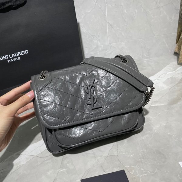 SAINT LAURENT Niki Baby in Crinkled Vintage Leather. Original Quality Bag including gift box, care book, dust bag, authenticity card. This bag is much more than a shoulder bag. It’s practical, elegant and modern. The chain really adds a nice finishing touch to it. The center comes with the signature YSL logo, which makes the bag very classy. The crinkled leather is eye-catching and creates a nice texture for the luxury experience. SAINT LAURENT monogram bag featuring a relaxed shape, a rectangular body, a quilted effect, a fold over top with magnetic closure, a front logo plaque, a main internal compartment, an internal zipped pocket, a front slip pocket and a leather convertible shoulder strap.