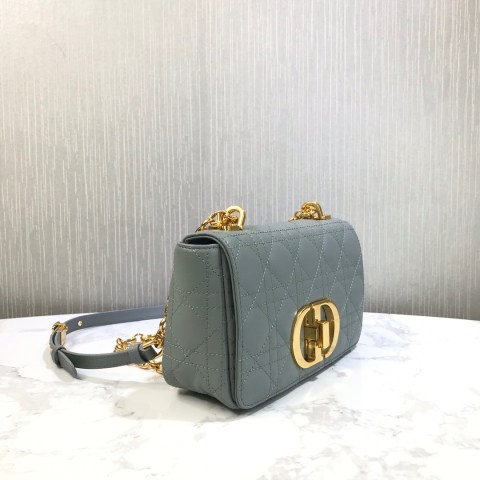 DIOR Small Caro Bag. Thanks to the iconi Cannage Stitching, The Dior Small Caro Bag feels a bit like the Lady Dior Bag and looks both feminine and classic. The Cannage Stitching is instantly recognizable, because it’s one of the house’s oldest and iconic pattern. The center features a new metal twist CD Lock, which is crafted in large size – no eyes can miss this. The top comes with a signature CD chain link shoulder strap, but it can also be replaced with a wide embroidered strap to make it playful. The option to change the chain also allows the bag to be worn with different outfit and looks. The bag is embossed with 30 Montaigne signature on the back. The inside is made with one main compartment and interior zip and patch pockets. There is also a back pocket available for instant access to your essentials.