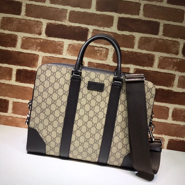 GUCCI GG Supreme Men's Briefcase. Original quality briefcase including gift box, booklet, dust bag, authenticity card. Ideal for the discerning man about town, this GG Supreme laptop bag from Gucci is sure to impress. Whether for a business trip, client meeting, or work event, this bag is designed with luxury in mind. Featuring leather trim, round top handles, a top zip fastening, an internal zip pocket, and signature web detachable and adjustable shoulder strap.