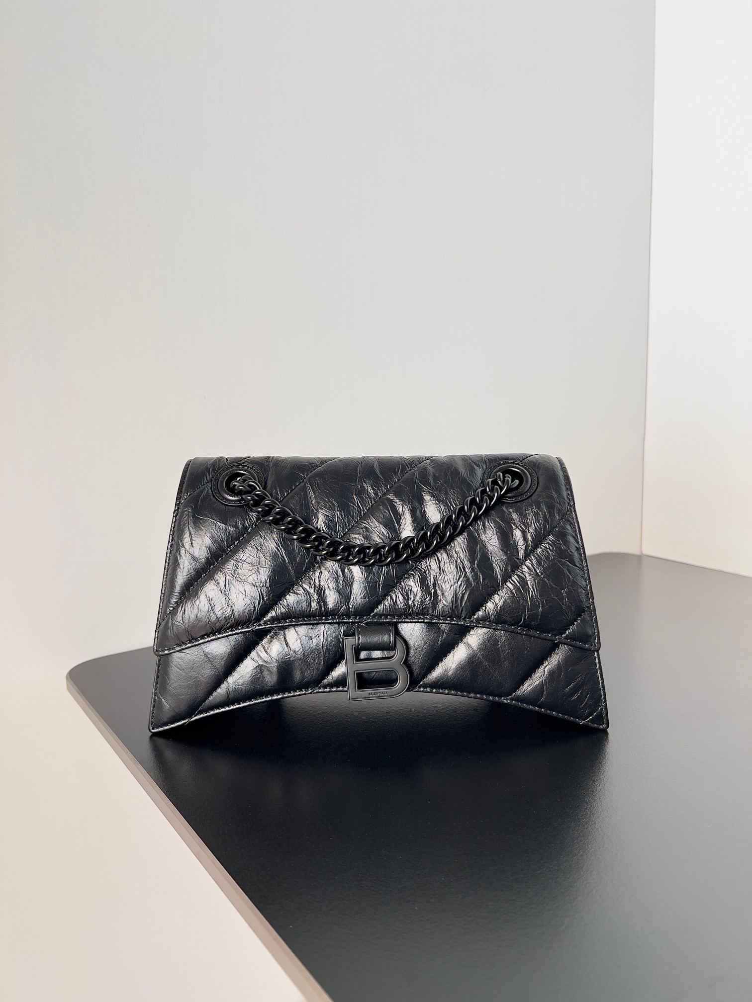 BALENCIAGA Crush Small Chain Bag. Original Quality Bag including gift box, care book, dust bag, authenticity card. Crush on this metallic Crush Chain Bag. This is a new iteration on their celebrated curvilinear design, complete with tonal B logo hardware and shoulder and crossbody chain. Crafted in a contemporary crushed quilted calfskin.