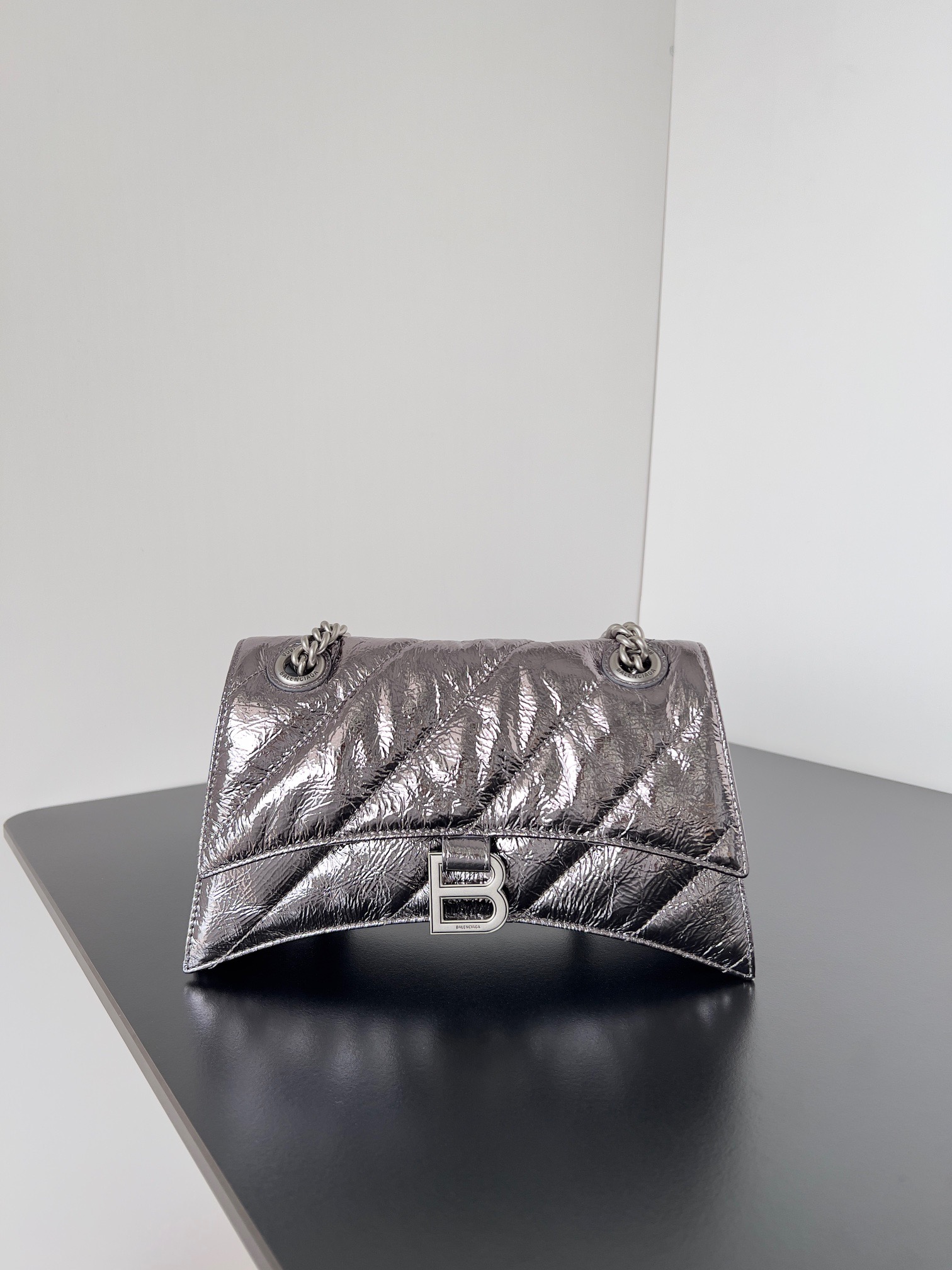 BALENCIAGA Crush Small Chain Bag. Original Quality Bag including gift box, care book, dust bag, authenticity card. Crush on this metallic Crush Chain Bag. This is a new iteration on their celebrated curvilinear design, complete with tonal B logo hardware and shoulder and crossbody chain. Crafted in a contemporary crushed quilted calfskin.