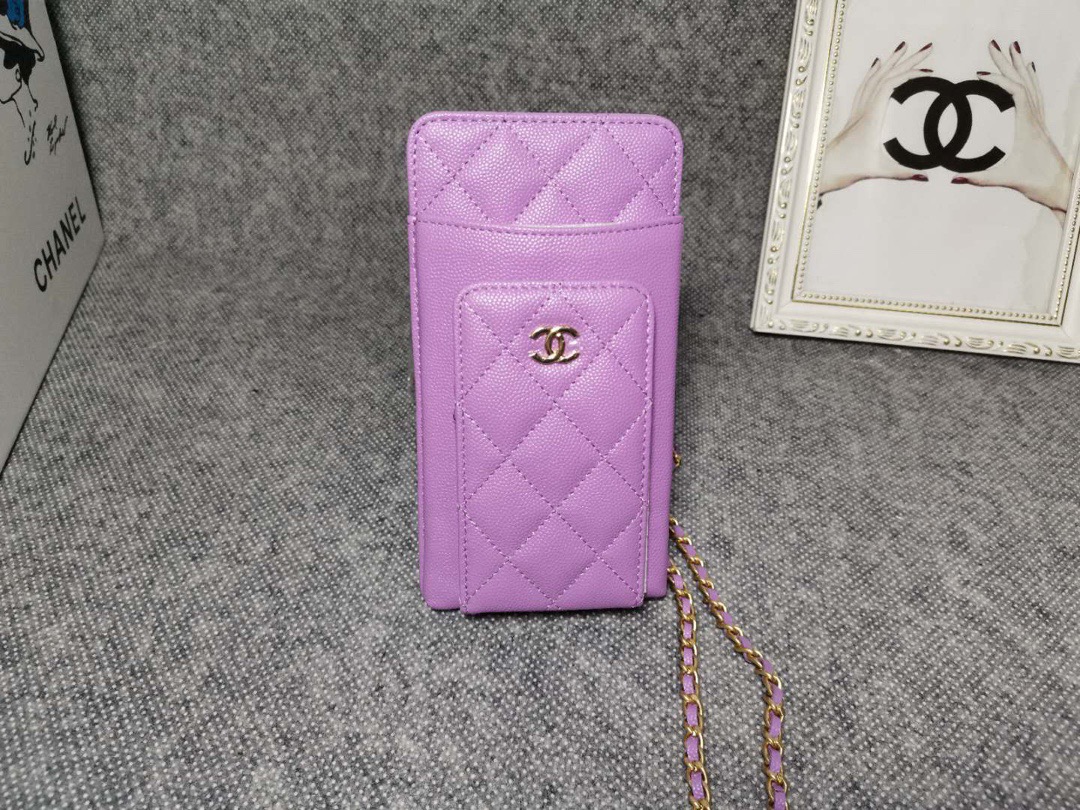 CHANEL Compact Double Pouch With Chain. This bag is designed with a Classic Look refined the gold toned iconic CC logo and the woven chain leather strap for shoulder carry. It’s made from soft and luxurious lambskin. The bag features a front pocket for card slots and several patch pockets including a center zip pocket. It’s a simple yet easy-to-transport bag for casual use, like a WOC but then smaller. Actually, it’s better than the Flat Wallet Pouch. More convenient thanks to the extra pockets..