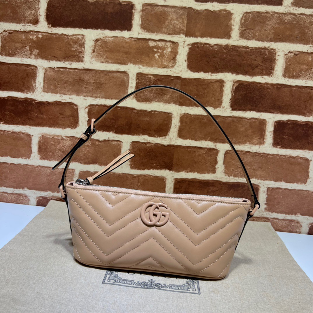 GUCCI GG Marmont Shoulder Bag. Original Quality Bag including gift box, care book, dust bag, authenticity card. The GG Marmont has become synonymous with the House, thanks to its recognizable matelassé fabric and Double G hardware. Continuously reinvented through the seasons, new shapes are introduced within this signature line, matching Gucci's contemporary vision. Presented here in chevron leather, it's further enriched with tonal details.