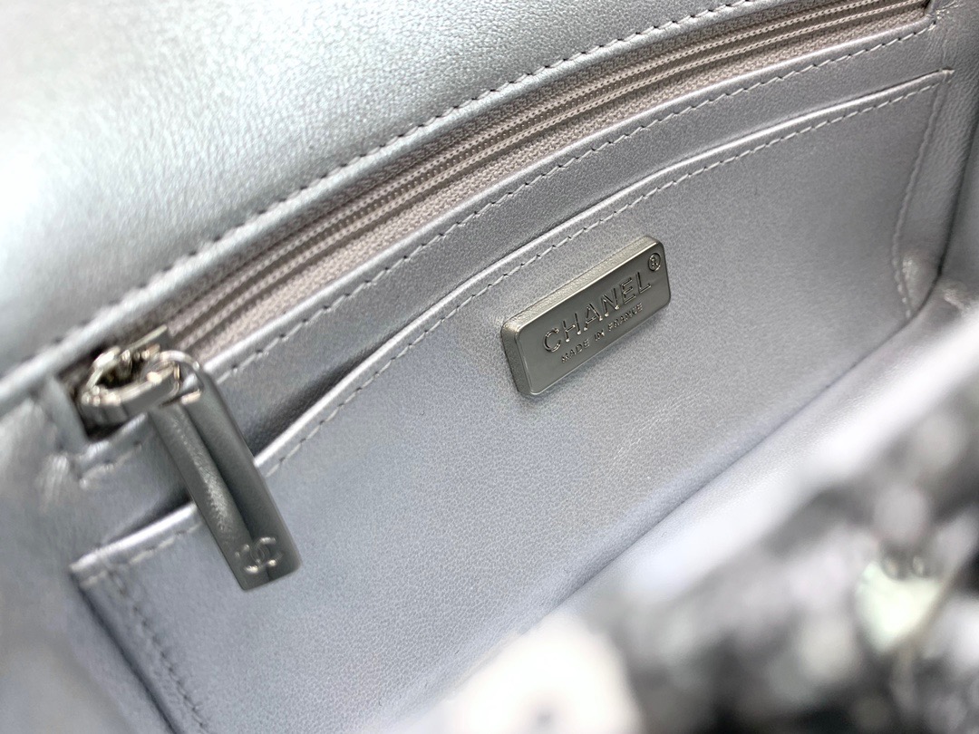 CHANEL Mini Flap Bag In Sequins. Original Quality Bag including gift box, care book, dust bag, authenticity card. This small sleek flap bag is beautifully crafted of the layering of small and large sequins that create the entire surface of the bag. The elegant handbag features polished chain link leather threaded shoulder straps and a Chanel CC turn lock. This opens to a leather interior with room for your necessities for day or evening with the timeless style.