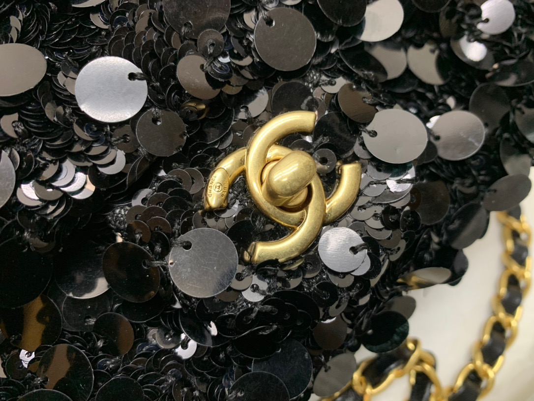 CHANEL Mini Flap Bag In Sequins. Original Quality Bag including gift box, care book, dust bag, authenticity card. This small sleek flap bag is beautifully crafted of the layering of small and large sequins that create the entire surface of the bag. The elegant handbag features polished chain link leather threaded shoulder straps and a Chanel CC turn lock. This opens to a leather interior with room for your necessities for day or evening with the timeless style.