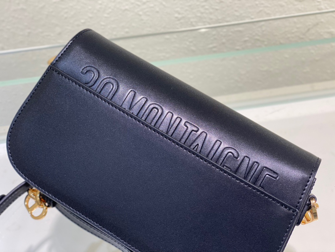 DIOR 30 Montaigne Avenue Bag. Original Quality Bag including gift box, care book, dust bag, authenticity card. The 30 Montaigne Avenue bag enhances the hallmark line with a timeless and elegant style. Crafted in box calfskin, the rounded flap with delicate curves is punctuated by an antique gold-finish metal CD clasp inspired by the seal of a Christian Dior perfume bottle. The design is completed by other details, like the 30 Montaigne signature embossed on the back and the signature chain alternating gold-finish metal and tonal enamel links that match the leather. The gusseted bag features a spacious and refined silhouette that can be carried by hand, worn over the shoulder or crossbody.