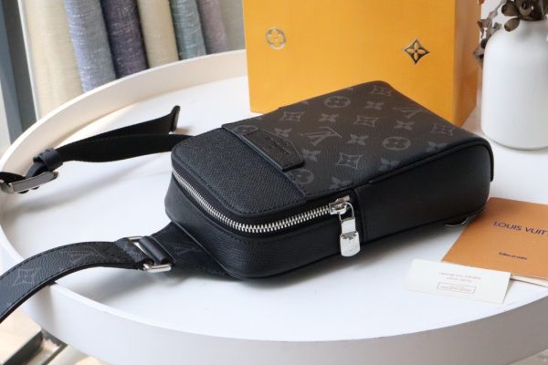 LOUIS VUITTON Outdoor Slingbag. From the latest Taigarama collection, here is the Outdoor Sling Bag, a sporty, easy-to-wear model constructed from a mix of tonal signature canvas and supple Taiga leather. Sized to carry essential goods, with a front pocket to stow ear phones or keys. The adjustable shoulder strap easily adapts for left or right carry.