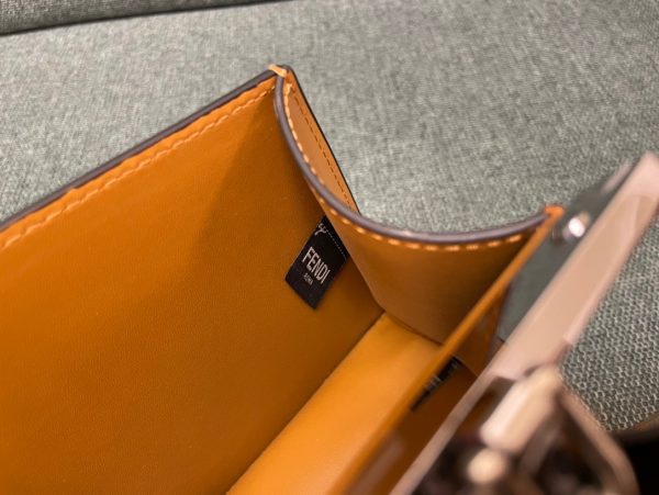 FENDI Peekaboo Cut. Original Quality Bag including gift box, care book, dust bag, authenticity card. Peekaboo Cut bag made of glossy leather. A new evolution of the iconic Peekaboo ISeeU, it has a striking horizontal cut that accentuates its classic features and reveals the metal bar and the iconic twist lock on both sides. It can be carried by hand or on the shoulder thanks to the chain embellished with O’Lock details.