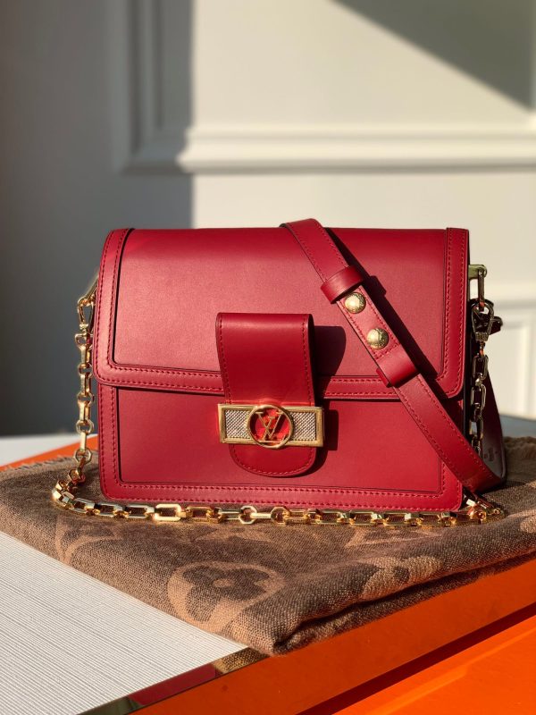 LOUIS VUITTON Mini Dauphine Crossbody and Shoulder Bag. Original Quality Bag including gift box, literature, dust bag, authenticity card. LOUIS VUITTON is expanding its Dauphine family with the Lugano Mini. In smooth calfskin leather, it features striking new signature touches like a gold LV circle lock trimmed with silver guilloche. Refined, elegant styling and convenient carry options make this bag a must-have for Dauphine lovers.