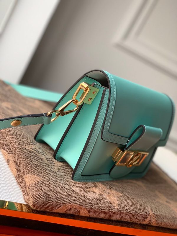 LOUIS VUITTON Mini Dauphine Crossbody and Shoulder Bag. Original Quality Bag including gift box, literature, dust bag, authenticity card. LOUIS VUITTON is expanding its Dauphine family with the Lugano Mini. In smooth calfskin leather, it features striking new signature touches like a gold LV circle lock trimmed with silver guilloche. Refined, elegant styling and convenient carry options make this bag a must-have for Dauphine lovers.