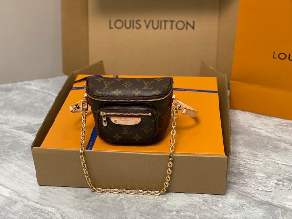 LOUIS VUITTON Mini Bumbag. High-End Quality Bag including gift box, care book, dust bag, authenticity card. Part of Louis Vuitton's Gradient Collection, the Mini Bumbag is an elegant take on the on-trend bag format. Crafted from Monogram Empreinte leather with a stunning printed gradation of colors, this bag will make a stylish addition to your accessory wardrobe. It features a zipped main compartment with a front pocket adorned with a Louis Vuitton leather tag as well as adjustable, removable straps that you can use for either cross-body or shoulder wear. This Mini Bumbag also comes with a stylish, gold-tone chain making it the perfect accessory for any summer occasion.