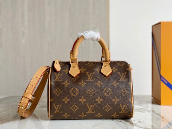 LOUIS VUITTON Speedy Bandoulière 20. Experience elegance and sophistication with this timeless designer handbag. This is an iconic and stylish designer handbag, perfect for any fashionable woman. The Speedy Bandoulière 20 has all the features that make Louis Vuitton such a sought-after luxury brand. This bag has a resilient material, deep pockets, a spacious interior, and an adjustable shoulder strap. The exterior is crafted from durable and elegant Monogram canvas, giving it a timeless style that will last for years. It also features a discreet Lozine trim, making it both striking and sophisticated. Inside, it is lined with matching textiles with a pocket for small items, ensuring all your essentials are secure and organized. The adjustable strap allows you to wear the bag on the shoulder or carry it as a top handle bag, making it perfect for either day or night. And with a zip closure, you can always rest assured that all your items are safely contained. The Speedy Bandoulière 20 is sure to add a touch of luxury to any look.