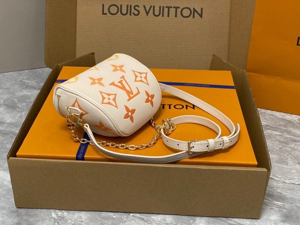 LOUIS VUITTON Mini Bumbag. High-End Quality Bag including gift box, care book, dust bag, authenticity card. Part of Louis Vuitton's Gradient Collection, the Mini Bumbag is an elegant take on the on-trend bag format. Crafted from Monogram Empreinte leather with a stunning printed gradation of colors, this bag will make a stylish addition to your accessory wardrobe. It features a zipped main compartment with a front pocket adorned with a Louis Vuitton leather tag as well as adjustable, removable straps that you can use for either cross-body or shoulder wear. This Mini Bumbag also comes with a stylish, gold-tone chain making it the perfect accessory for any summer occasion.