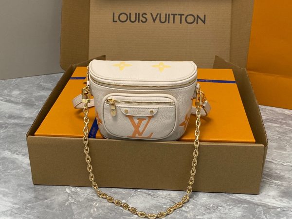 LOUIS VUITTON Mini Bumbag. High-End Quality Bag including gift box, care book, dust bag, authenticity card. Part of Louis Vuitton's Gradient Collection, the Mini Bumbag is an elegant take on the on-trend bag format. Crafted from Monogram Empreinte leather with a stunning printed gradation of colors, this bag will make a stylish addition to your accessory wardrobe. It features a zipped main compartment with a front pocket adorned with a Louis Vuitton leather tag as well as adjustable, removable straps that you can use for either cross-body or shoulder wear. This Mini Bumbag also comes with a stylish, gold-tone chain making it the perfect accessory for any summer occasion.