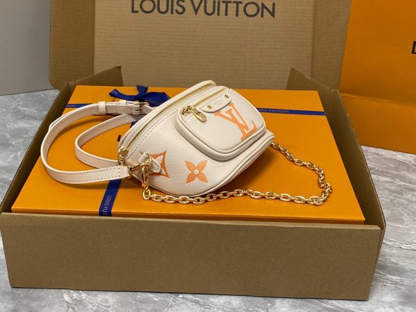LOUIS VUITTON Mini Bumbag. High-End Quality Bag including gift box, care book, dust bag, authenticity card. Part of Louis Vuitton's Gradient Collection, the Mini Bumbag is an elegant take on the on-trend bag format. Crafted from Monogram Empreinte leather with a stunning printed gradation of colors, this bag will make a stylish addition to your accessory wardrobe. It features a zipped main compartment with a front pocket adorned with a Louis Vuitton leather tag as well as adjustable, removable straps that you can use for either cross-body or shoulder wear. This Mini Bumbag also comes with a stylish, gold-tone chain making it the perfect accessory for any summer occasion.