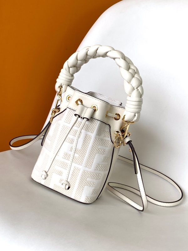 FENDI Mon Tresor Mini Bucket Bag: Style Meets Practicality This Mon Tresor Bag is a chic, minimalist dream. With its drawstring fastening and metal detailing on the sides and eyelets, this bag is as practical as a backpack and can be worn in different ways with its two detachable shoulder straps. It promises a spacious interior and supple leather construction to help store more than the average duffle bag or shoulder bag can manage. Despite it's thoughtfully practical design, it still looks luxurious and glamorous - no wonder it comes with a designer price tag!