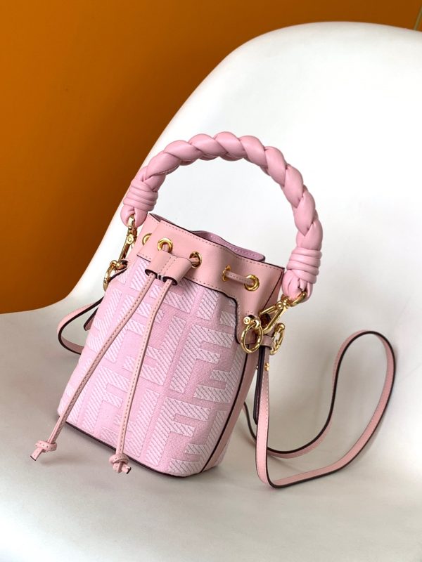 FENDI Mon Tresor Mini Bucket Bag: Style Meets Practicality This Mon Tresor Bag is a chic, minimalist dream. With its drawstring fastening and metal detailing on the sides and eyelets, this bag is as practical as a backpack and can be worn in different ways with its two detachable shoulder straps. It promises a spacious interior and supple leather construction to help store more than the average duffle bag or shoulder bag can manage. Despite it's thoughtfully practical design, it still looks luxurious and glamorous - no wonder it comes with a designer price tag!