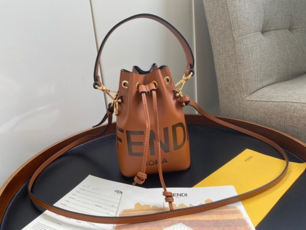 FENDI Mon Tresor Mini Bucket Bag: Style Meets Practicality This Mon Tresor Bag is a chic, minimalist dream. With its drawstring fastening and metal detailing on the sides and eyelets, this bag is as practical as a backpack and can be worn in different ways with its two detachable shoulder straps. It promises a spacious interior and supple leather construction to help store more than the average duffle bag or shoulder bag can manage. Despite it's thoughtfully practical design, it still looks luxurious and glamorous - no wonder it comes with a designer price tag!