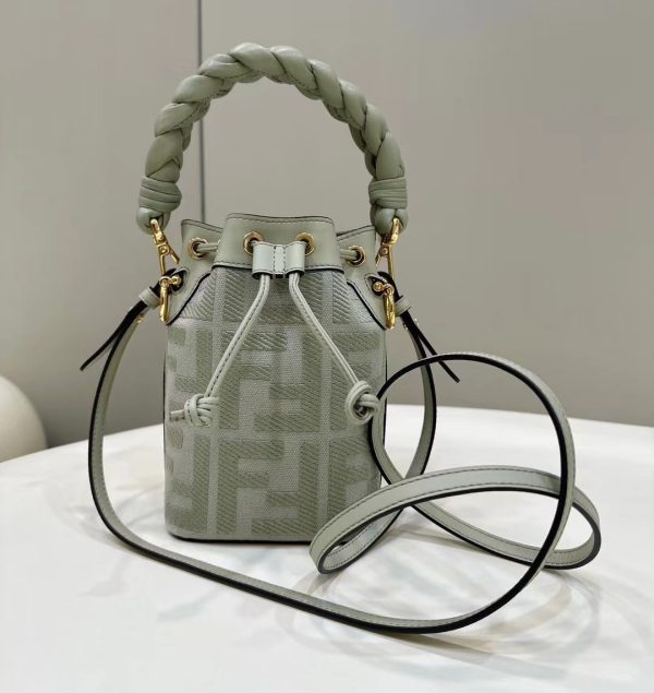 FENDI Mon Tresor Mini Bucket Bag: Style Meets Practicality This Mon Tresor Bag is a chic, minimalist dream. With its drawstring fastening and metal detailing on the sides and eyelets, this bag is as practical as a backpack and can be worn in different ways with its two detachable shoulder straps. It promises a spacious interior and supple leather construction to help store more than the average duffle bag or shoulder bag can manage. Despite it's thoughtfully practical design, it still looks luxurious and glamorous - no wonder it comes with a designer price tag!