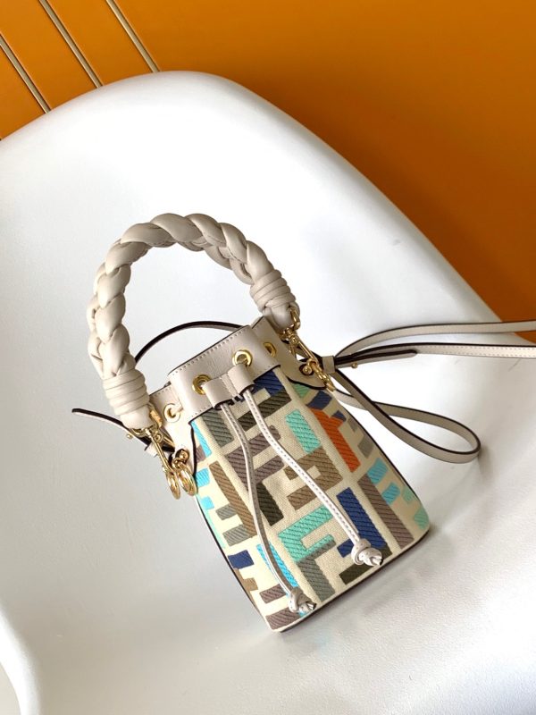 FENDI Mon Tresor Mini Bucket Bag: Style Meets Practicality This Mon Tresor Bag is a chic, minimalist dream. With its drawstring fastening and metal detailing on the sides and eyelets, this bag is as practical as a backpack and can be worn in different ways with its two detachable shoulder straps. It promises a spacious interior and supple leather construction to help store more than the average duffle bag or shoulder bag can manage. Despite it's thoughtfully practical design, it still looks luxurious and glamorous - no wonder it comes with a designer price tag!