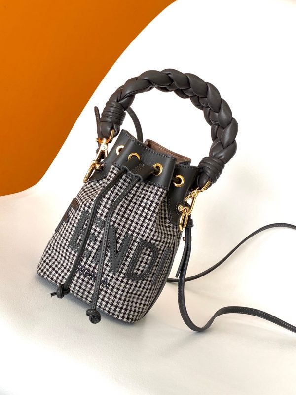 FENDI Mon Tresor Mini Bucket Bag: Style Meets Practicality This Mon Tresor Bag is a chic, minimalist dream. With its drawstring fastening and metal detailing on the sides and eyelets, this bag is as practical as a backpack and can be worn in different ways with its two detachable shoulder straps. It promises a spacious interior and supple leather construction to help store more than the average duffle bag or shoulder bag can manage. Despite it's thoughtfully practical design, it still looks luxurious and glamorous - no wonder it comes with a designer price tag!