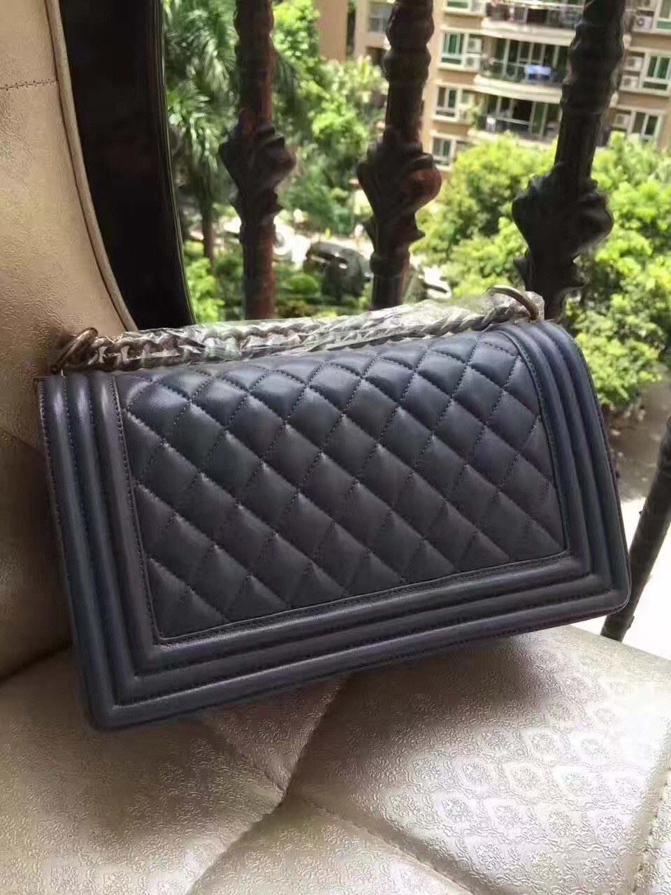 CHANEL 'Boy' Diamond Quilted Leather Flap Bag. Original Quality Bag including gift box, care book, dust bag, authenticity card. Created by Karl Lagerfeld, the iconic design owes its name to Gabrielle Chanel's first love, Boy Capel. This Chanel Boy Flap Bag Quilted is every woman's dream. Crafted from calfskin leather, the bag features Chanel's signature diamond quilting, chunky chain link strap with leather shoulder pad, and metal-tone hardware accents. Its CC Boy logo closure opens to a fabric-lined interior with slip pocket perfect for daily essentials. A sought-after, luxurious accessory.