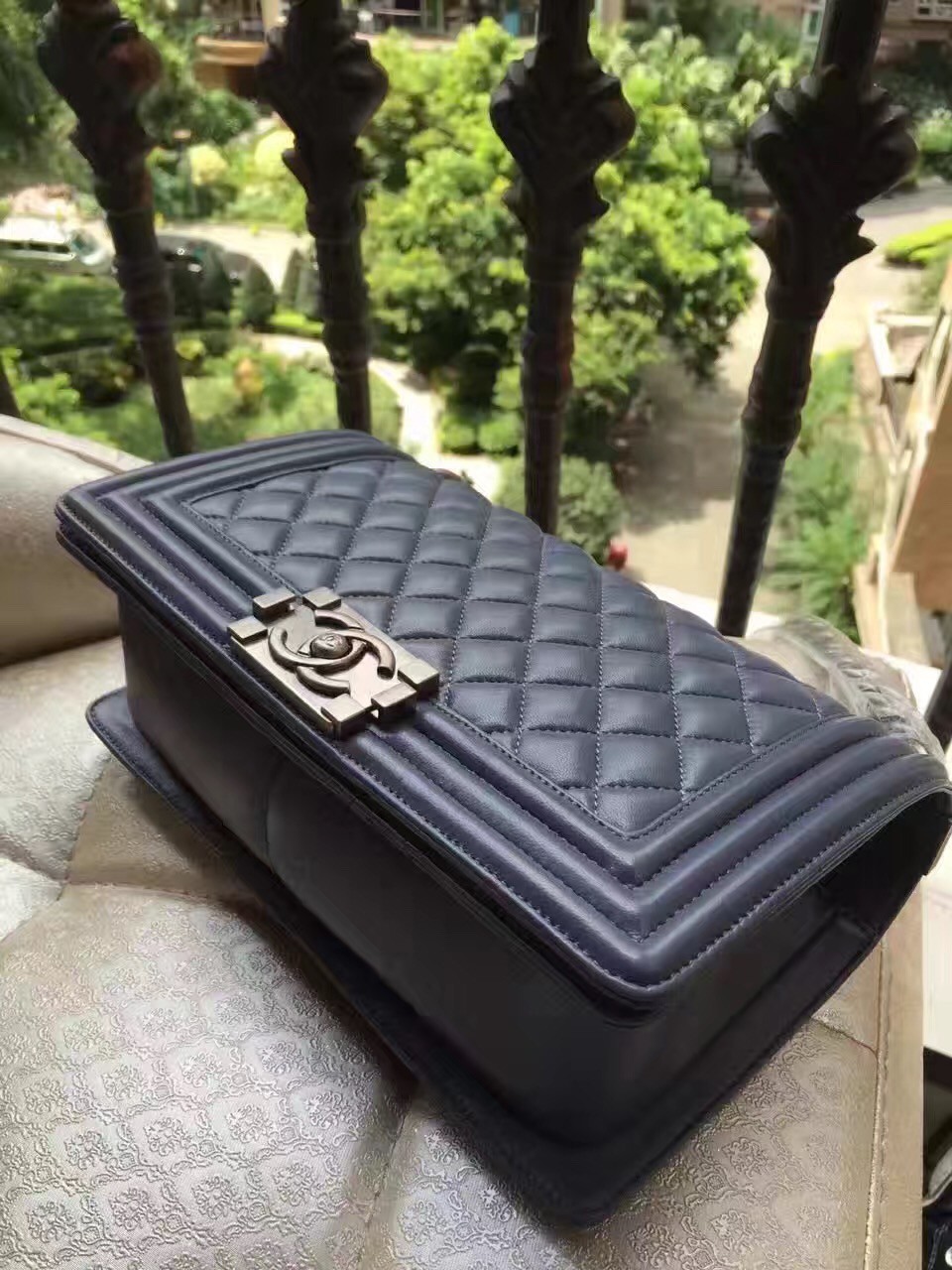 CHANEL 'Boy' Diamond Quilted Leather Flap Bag. Original Quality Bag including gift box, care book, dust bag, authenticity card. Created by Karl Lagerfeld, the iconic design owes its name to Gabrielle Chanel's first love, Boy Capel. This Chanel Boy Flap Bag Quilted is every woman's dream. Crafted from calfskin leather, the bag features Chanel's signature diamond quilting, chunky chain link strap with leather shoulder pad, and metal-tone hardware accents. Its CC Boy logo closure opens to a fabric-lined interior with slip pocket perfect for daily essentials. A sought-after, luxurious accessory.