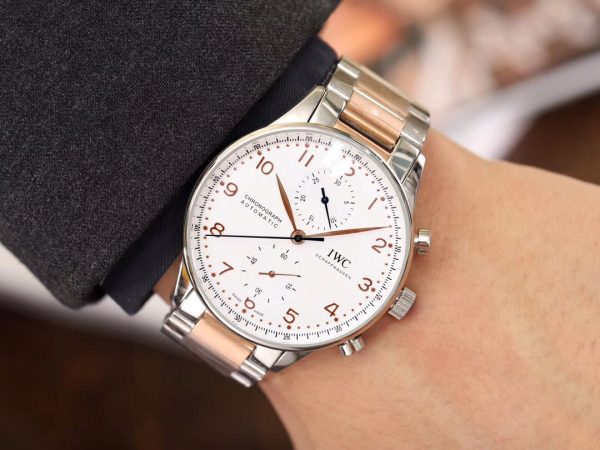 IWC 'Portugieser' Chronograph. Original Quality Watch. Authentic Sales box, authenticity card, sales slip, booklet. Stainless steel case. Fixed stainless steel bezel. Dial with steel hands and Arabic numeral hour markers. Minute markers around the outer rim. Dial Type: Analog. Luminescent hands and markers. Chronograph - two sub-dials displaying: 60 seconds and 30 minutes. Automatic movement with a 44-hour power reserve. Scratch resistant sapphire crystal. Solid case back. Case diameter: 40.9 mm. Case thickness: 12.3 mm. Round case shape. Deployment clasp. Functions: hours, minutes, seconds, chronograph. Luxury watch style.