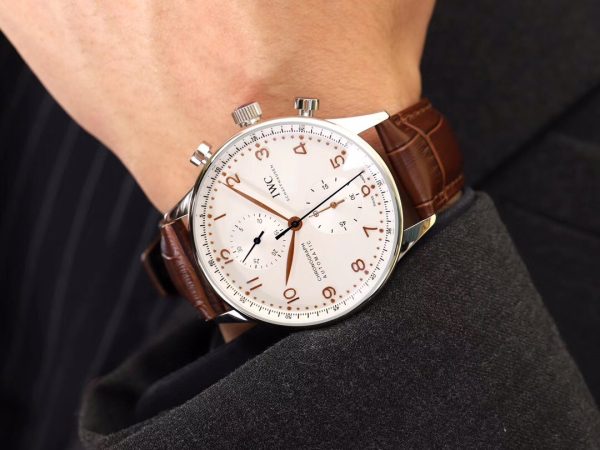 IWC 'Portugieser' Chronograph. Original Quality Watch. Authentic Sales box, authenticity card, sales slip, booklet. Stainless steel case. Fixed stainless steel bezel. Dial with steel hands and Arabic numeral hour markers. Minute markers around the outer rim. Dial Type: Analog. Luminescent hands and markers. Chronograph - two sub-dials displaying: 60 seconds and 30 minutes. Automatic movement with a 44-hour power reserve. Scratch resistant sapphire crystal. Solid case back. Case diameter: 40.9 mm. Case thickness: 12.3 mm. Round case shape. Deployment clasp. Functions: hours, minutes, seconds, chronograph. Luxury watch style.