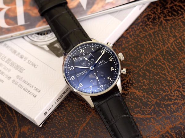 IWC 'Portugieser' Chronograph. Original Quality Watch. Authentic Sales box, authenticity card, sales slip, booklet. Stainless steel case. Fixed stainless steel bezel. Dial with steel hands and Arabic numeral hour markers. Minute markers around the outer rim. Dial Type: Analog. Luminescent hands and markers. Chronograph - two sub-dials displaying: 60 seconds and 30 minutes. Automatic movement with a 44-hour power reserve. Scratch resistant sapphire crystal. Solid case back. Case diameter: 40.9 mm. Case thickness: 12.3 mm. Round case shape. Deployment clasp. Functions: hours, minutes, seconds, chronograph. Luxury watch style.