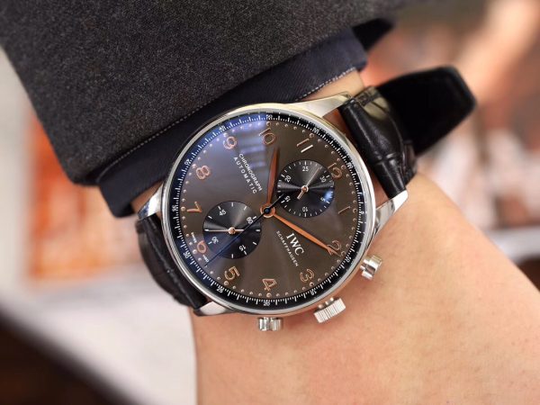 IWC 'Portugieser' Chronograph. Original Quality Watch. Authentic Sales box, authenticity card, sales slip, booklet. Stainless steel case. Fixed stainless steel bezel. Dial with steel hands and Arabic numeral hour markers. Minute markers around the outer rim. Dial Type: Analog. Luminescent hands and markers. Chronograph - two sub-dials displaying: 60 seconds and 30 minutes. Automatic movement with a 44-hour power reserve. Scratch resistant sapphire crystal. Solid case back. Case diameter: 40.9 mm. Case thickness: 12.3 mm. Round case shape. Deployment clasp. Functions: hours, minutes, seconds, chronograph. Luxury watch style.