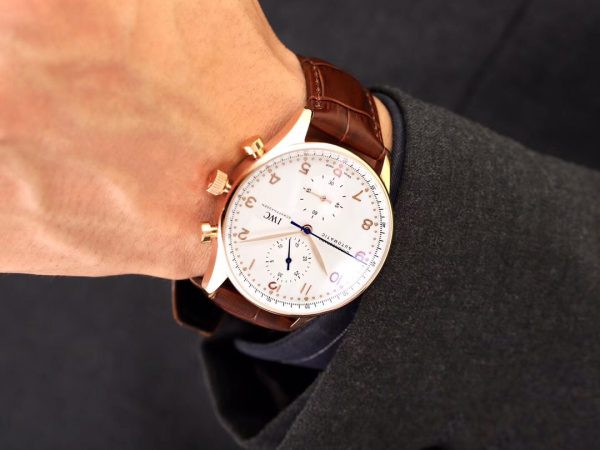 IWC 'Portugieser' Chronograph. Original Quality Watch. Authentic Sales box, authenticity card, sales slip, booklet. Stainless steel case. Fixed stainless steel bezel. Dial with steel hands and Arabic numeral hour markers. Minute markers around the outer rim. Dial Type: Analog. Luminescent hands and markers. Chronograph - two sub-dials displaying: 60 seconds and 30 minutes. Automatic movement with a 44-hour power reserve. Scratch resistant sapphire crystal. Solid case back. Case diameter: 40.9 mm. Case thickness: 12.3 mm. Round case shape. Deployment clasp. Functions: hours, minutes, seconds, chronograph. Luxury watch style.