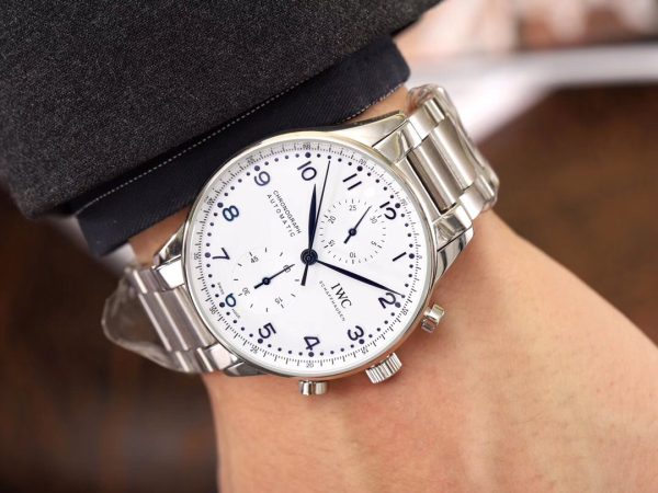 IWC 'Portugieser' Chronograph. Original Quality Watch. Authentic Sales box, authenticity card, sales slip, booklet. Stainless steel case. Fixed stainless steel bezel. Dial with steel hands and Arabic numeral hour markers. Minute markers around the outer rim. Dial Type: Analog. Luminescent hands and markers. Chronograph - two sub-dials displaying: 60 seconds and 30 minutes. Automatic movement with a 44-hour power reserve. Scratch resistant sapphire crystal. Solid case back. Case diameter: 40.9 mm. Case thickness: 12.3 mm. Round case shape. Deployment clasp. Functions: hours, minutes, seconds, chronograph. Luxury watch style.
