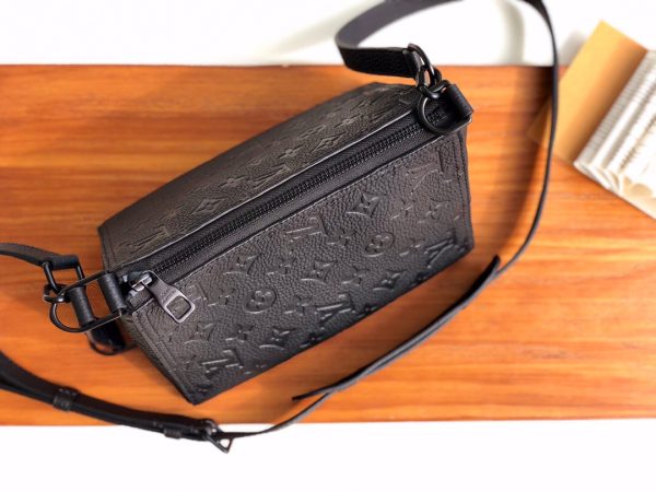 LOUIS VUITTON Triangle Messenger Bag. Original Quality Bag including gift box, care book, dust bag, authenticity card. Made from luxurious black Taurillon leather embossed with the Monogram motif, this Triangle Messenger bag is instantly recognizable by its unexpected triangular shape. The side and front leather straps allow both horizontal and vertical carry. Inspired by the design of the House’s Sac Tricot from 1934, Virgil Abloh has created a stylish small bag for men.