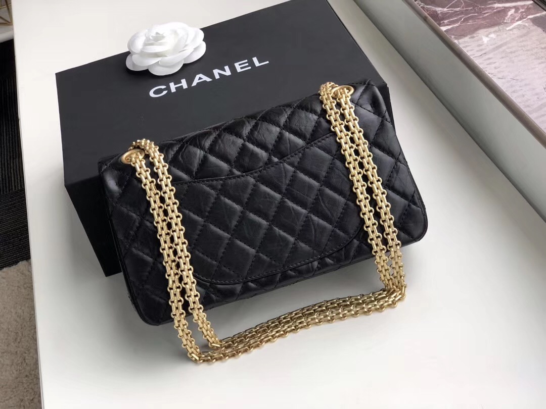 Original Quality Bag. Authentic aged calfskin. Aged Metal Toned Hardware. CHANEL Sales Box and Dust Bag. Booklet, Authenticity Card. In February 2005, Karl Lagerfeld re-made the 2.55, precisely as Coco Chanel had made in 1955, in commemoration of the 50th anniversary of the 2.55. It came to be known as the Reissue. As an homage to Coco's upbringing in an orphanage, the 2.55 was outfitted with a double chain, reminding of the dangled keychains of her caretakers. The brownish-red color of the inside represents the color of the children's uniforms. A zipped compartment on the inside of the front flap was added where Coco would hide her love letters. The back outside flap of the 2.55 Reissue marks where Coco would stash her cash.