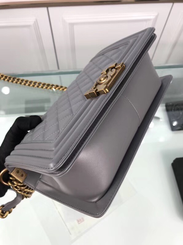 CHANEL 'Boy' Diamond Quilted Leather Flap Bag. Original Quality Bag including gift box, care book, dust bag, authenticity card. Created by Karl Lagerfeld, the iconic design owes its name to Gabrielle Chanel's first love, Boy Capel. This Chanel Boy Flap Bag Quilted is every woman's dream. Crafted from calfskin leather, the bag features Chanel's signature diamond quilting, chunky chain link strap with leather shoulder pad, and metal-tone hardware accents. Its CC Boy logo closure opens to a fabric-lined interior with slip pocket perfect for daily essentials. A sought-after, luxurious accessory.