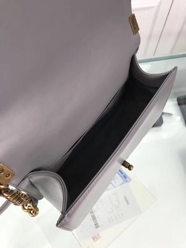 CHANEL 'Boy' Diamond Quilted Leather Flap Bag. Original Quality Bag including gift box, care book, dust bag, authenticity card. Created by Karl Lagerfeld, the iconic design owes its name to Gabrielle Chanel's first love, Boy Capel. This Chanel Boy Flap Bag Quilted is every woman's dream. Crafted from calfskin leather, the bag features Chanel's signature diamond quilting, chunky chain link strap with leather shoulder pad, and metal-tone hardware accents. Its CC Boy logo closure opens to a fabric-lined interior with slip pocket perfect for daily essentials. A sought-after, luxurious accessory.