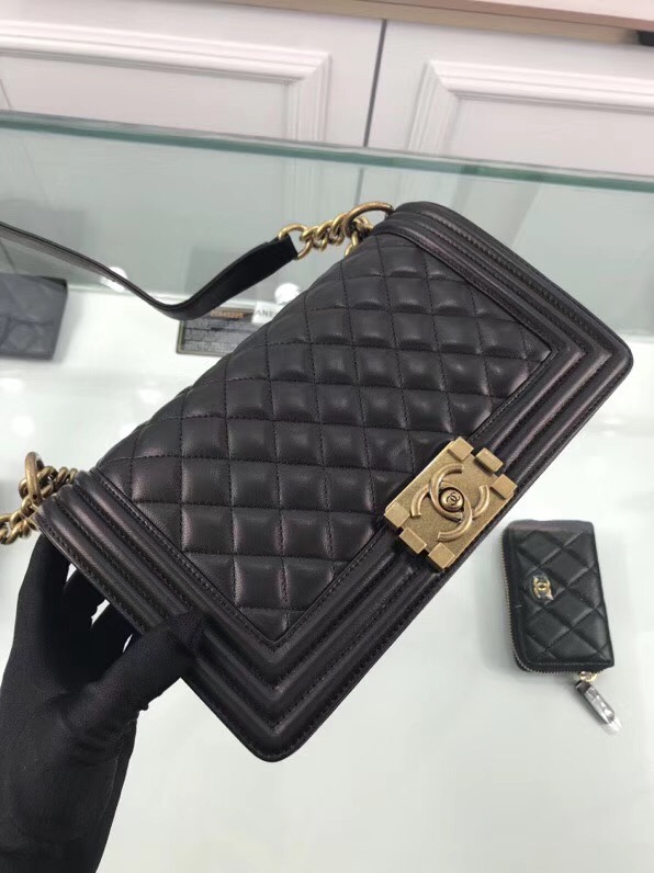 CHANEL 'Boy' Diamond Quilted Leather Flap Bag. Original Quality Bag including gift box, care book, dust bag, authenticity card. Created by Karl Lagerfeld, the iconic design owes its name to Gabrielle Chanel's first love, Boy Capel. This Chanel Boy Flap Bag Quilted is every woman's dream. Crafted from calfskin leather, the bag features Chanel's signature diamond quilting, chunky chain link strap with leather shoulder pad, and metal-tone hardware accents. Its CC Boy logo closure opens to a fabric-lined interior with slip pocket perfect for daily essentials. A sought-after, luxurious accessory.