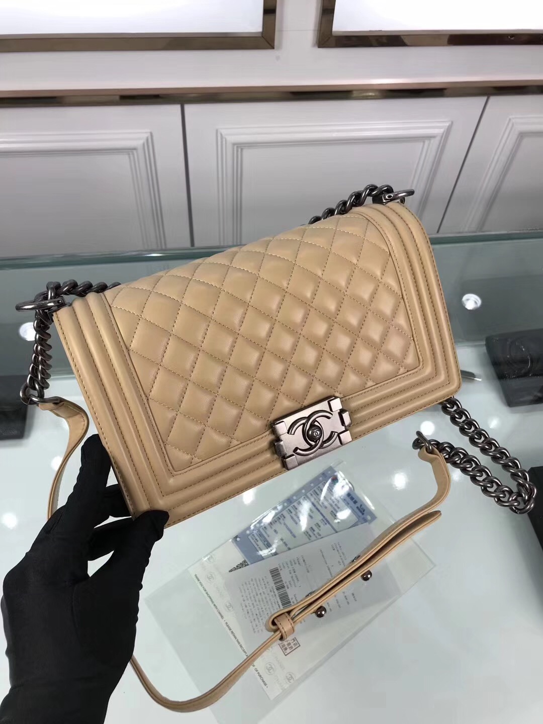 CHANEL 'Boy' Diamond Quilted Leather Flap Bag. Original Quality Bag including gift box, care book, dust bag, authenticity card. Created by Karl Lagerfeld, the iconic design owes its name to Gabrielle Chanel's first love, Boy Capel. This Chanel Boy Flap Bag Quilted is every woman's dream. Crafted from calfskin leather, the bag features Chanel's signature diamond quilting, chunky chain link strap with leather shoulder pad, and metal-tone hardware accents. Its CC Boy logo closure opens to a fabric-lined interior with slip pocket perfect for daily essentials. A sought-after, luxurious accessory.